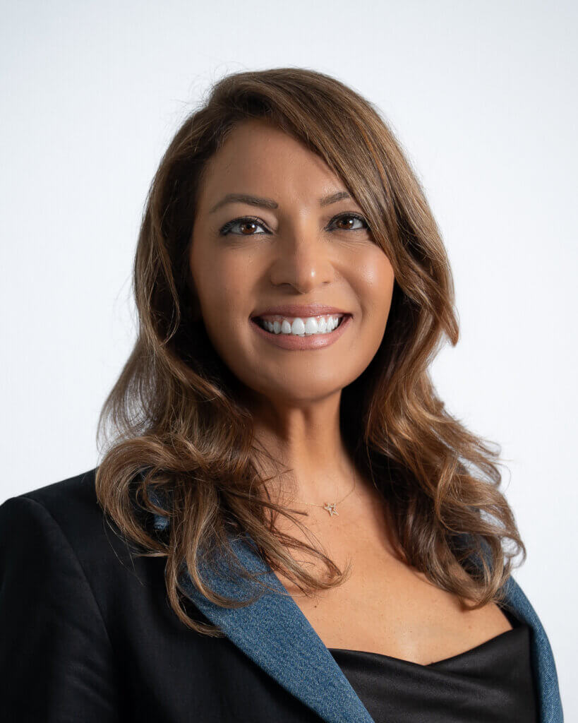 Smiling woman in business attire portrait with a blue jacket
