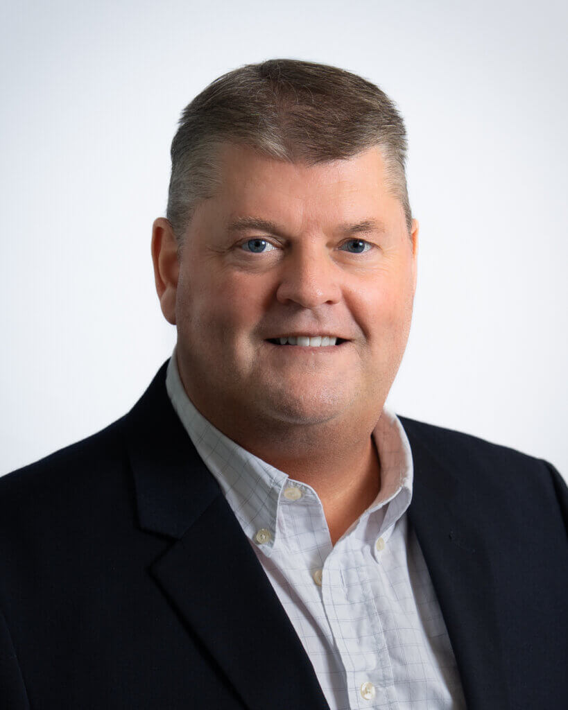 Smiling man in a business suit and shirt professional portrait
