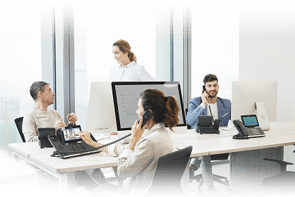 Office team collaborating and making phone calls at desks