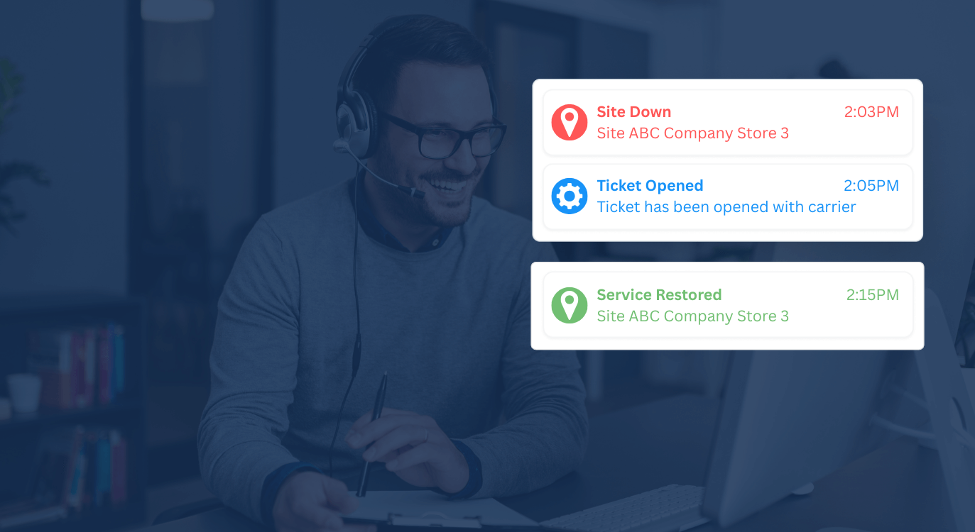 Man working at desk with service notifications on screen