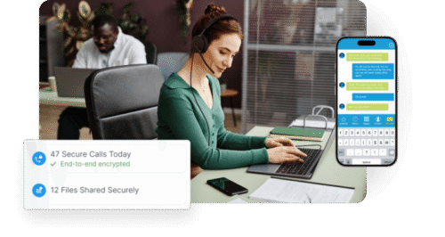 Woman working at office desk using laptop and smartphone app