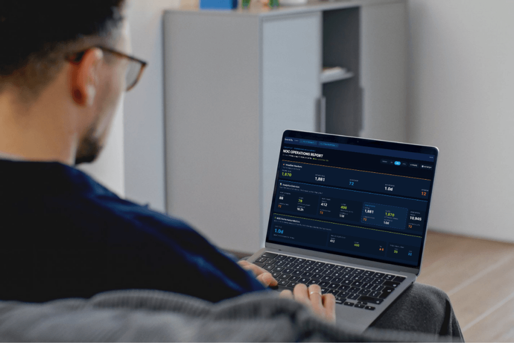 Man analyzing financial data on a laptop from home office